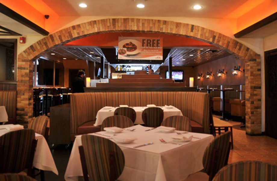 A restaurant with tables and chairs and a sign that says free