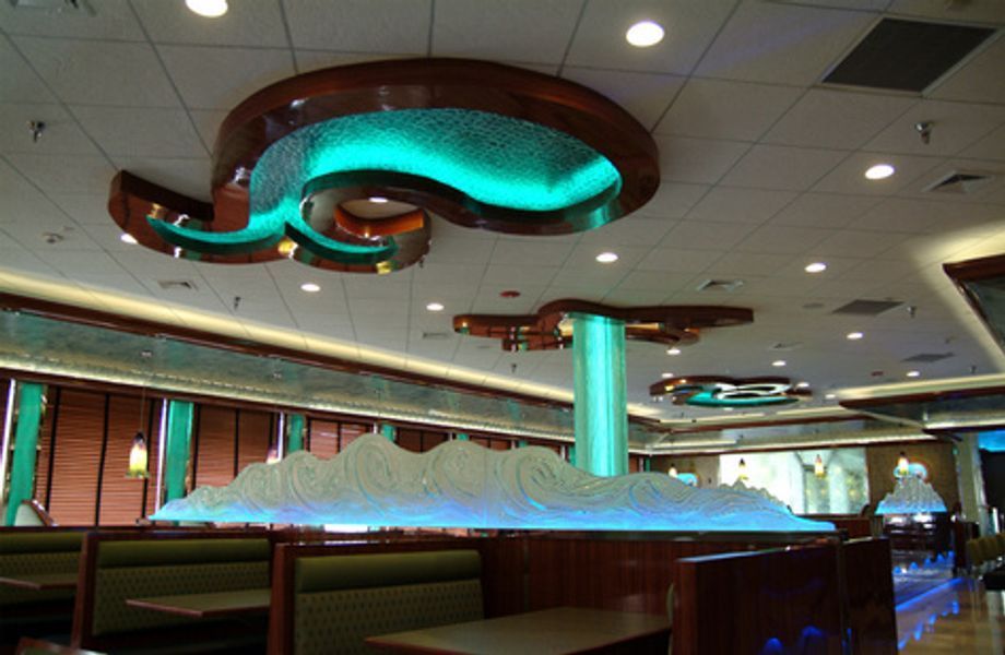 A diner with a ceiling that looks like a wave