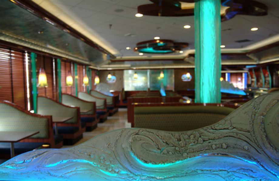 A restaurant with a blue light on the ceiling