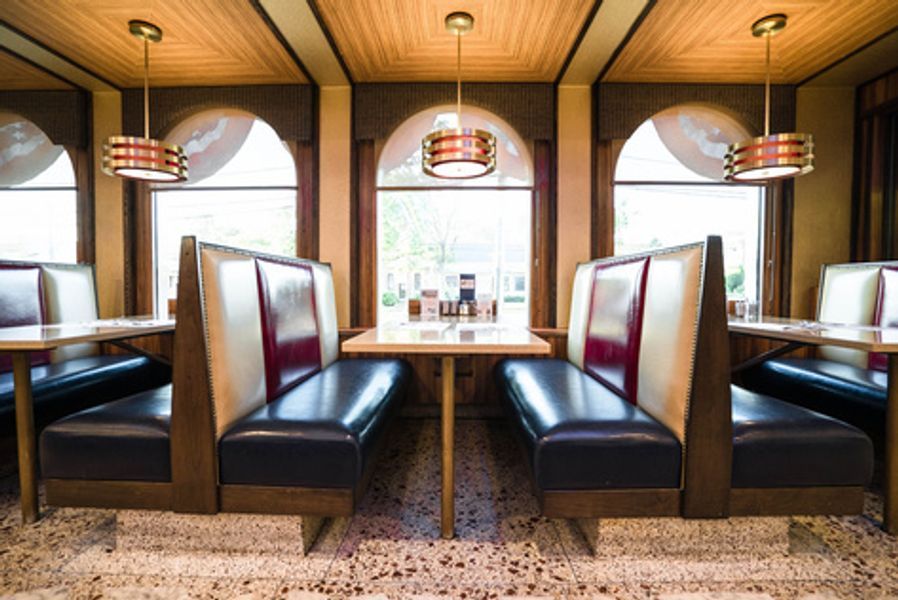 A diner with booths and tables in it
