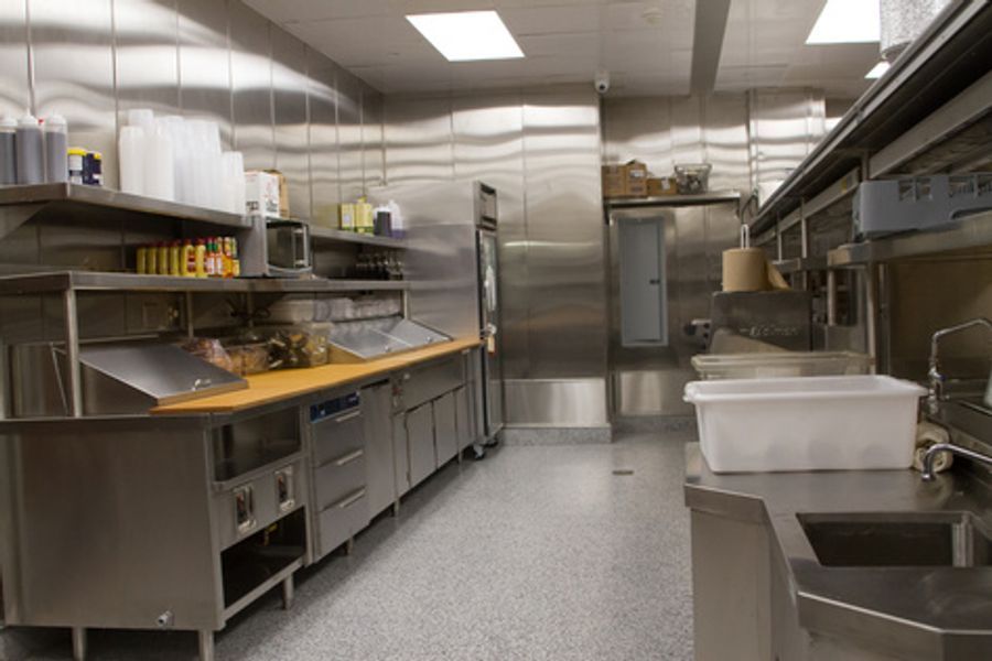 A kitchen with stainless steel appliances and a sink