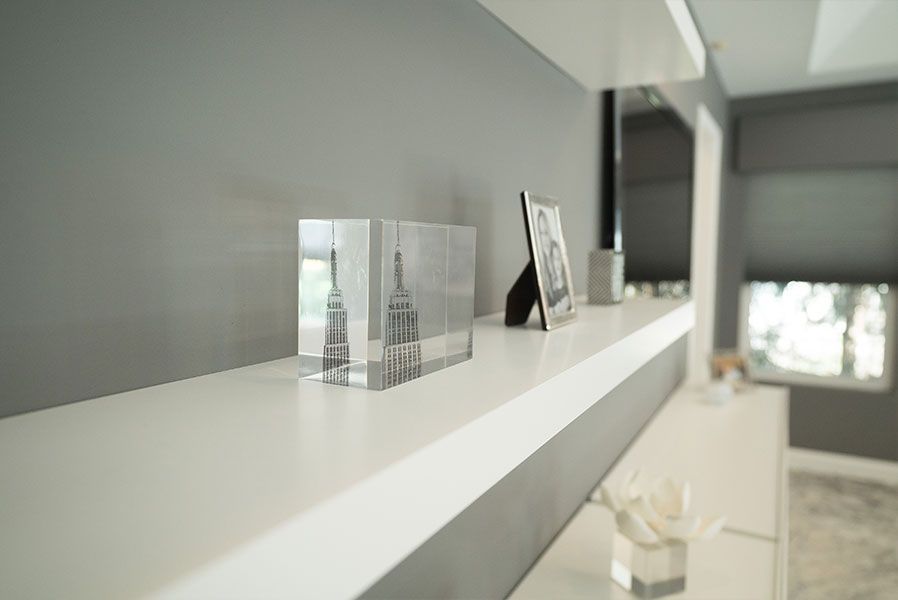 A white shelf with a picture of the eiffel tower on it