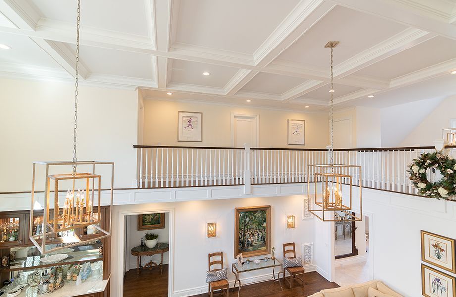 A living room with a balcony and a couch