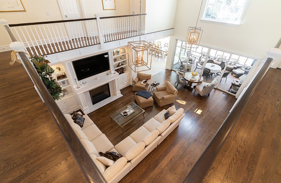An aerial view of a living room filled with furniture and a fireplace