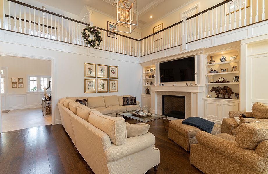 A living room filled with furniture and a fireplace