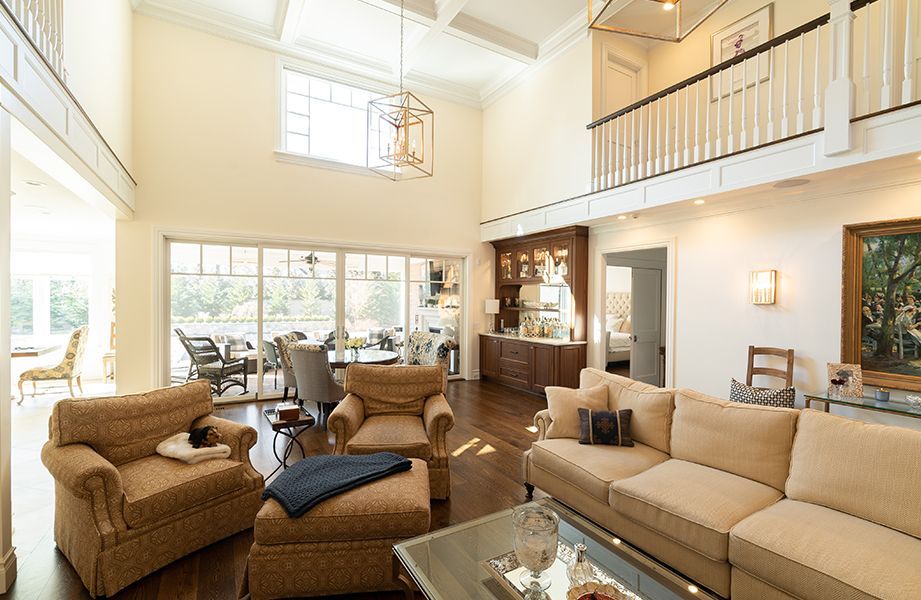 A living room with a couch, chairs, and a coffee table