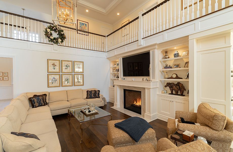 A living room filled with furniture and a fireplace