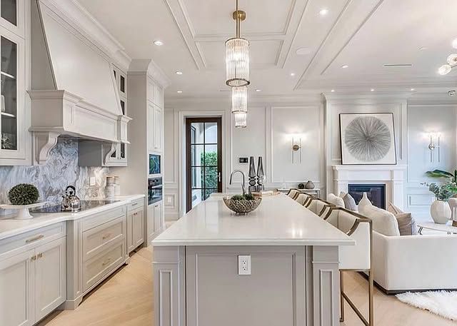 There is a large island in the middle of the kitchen.