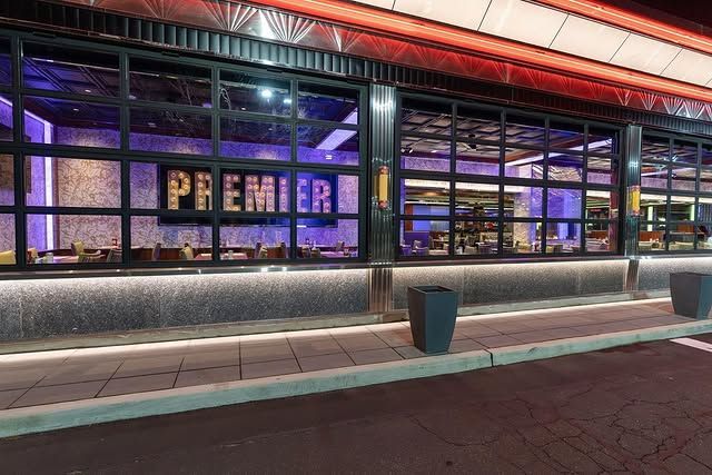 A restaurant with a lot of windows and a sign that says premier on it.