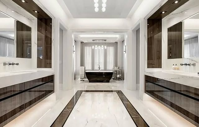 A bathroom with two sinks and a bathtub.