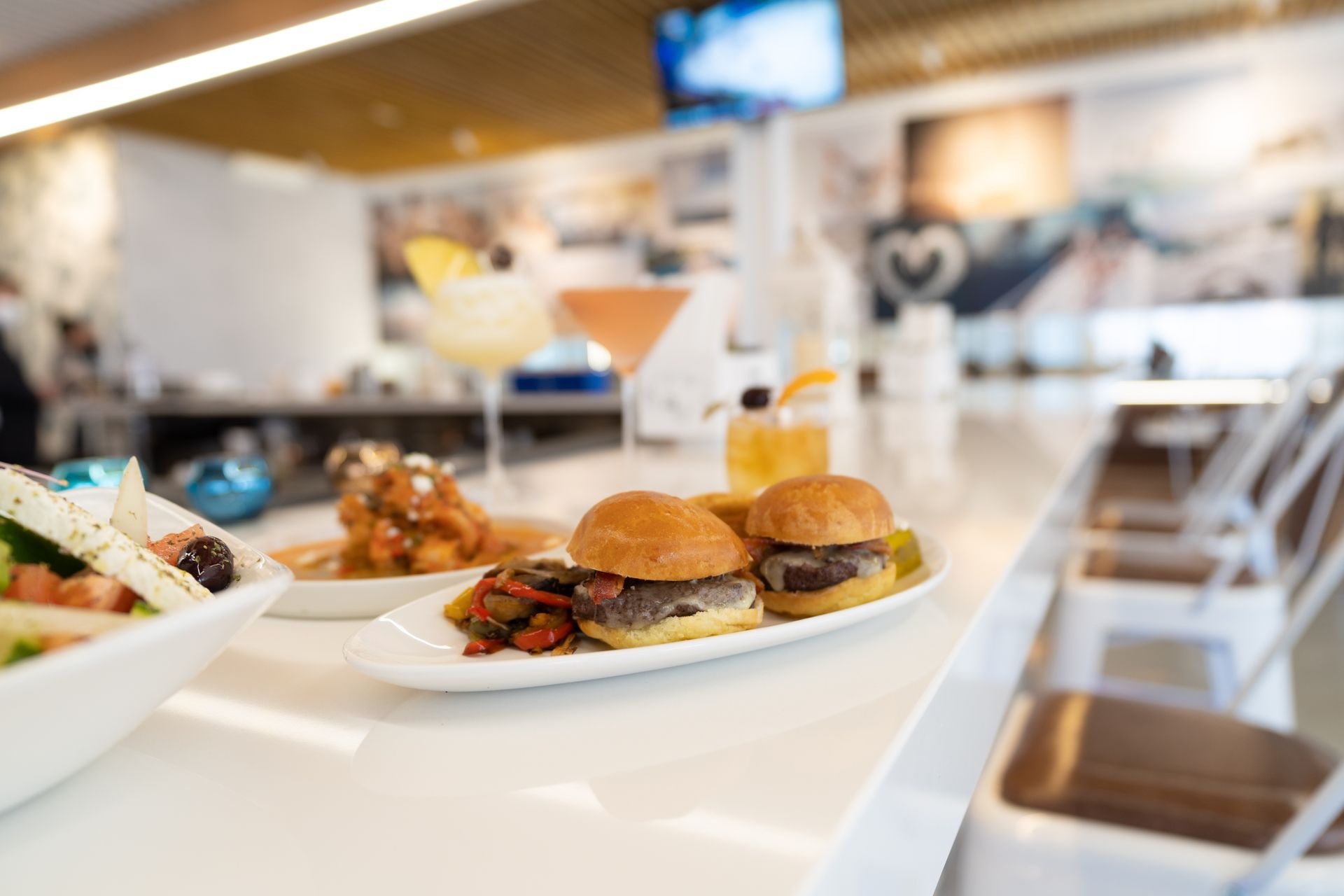 A plate of food is sitting on a counter in a restaurant.