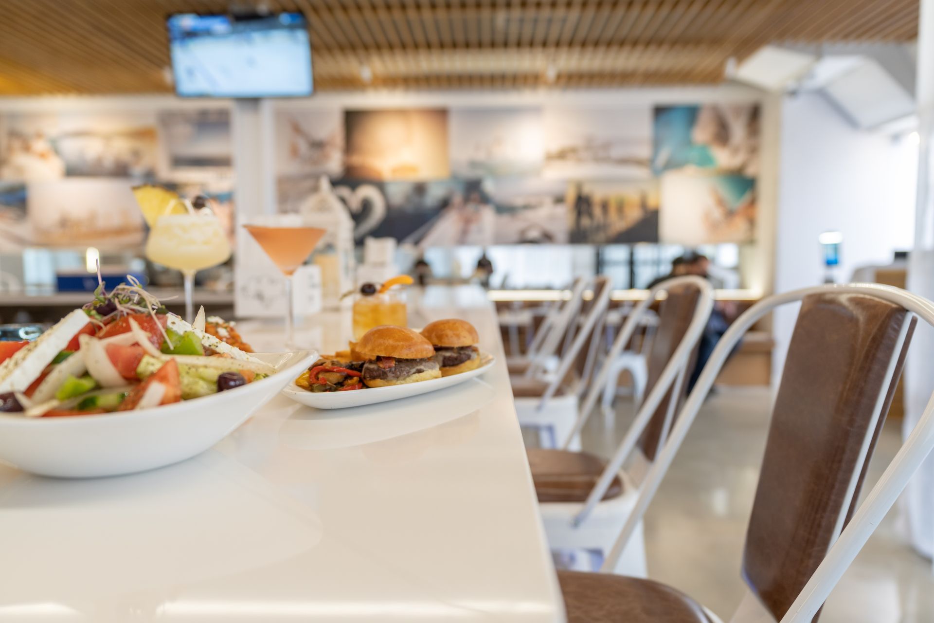 A plate of food is sitting on a table in a restaurant.