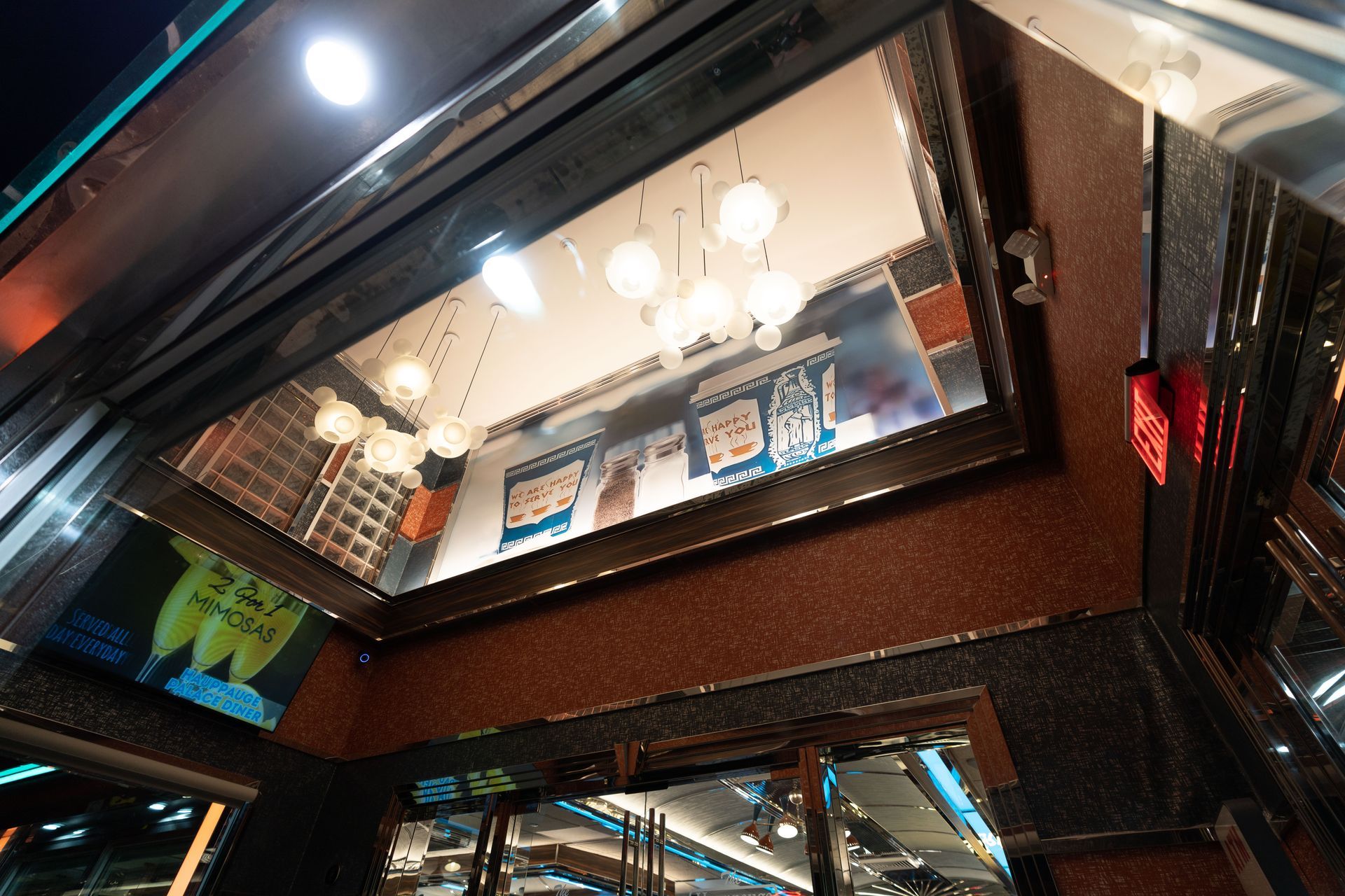 Looking up at the ceiling of a building with the word steel on it