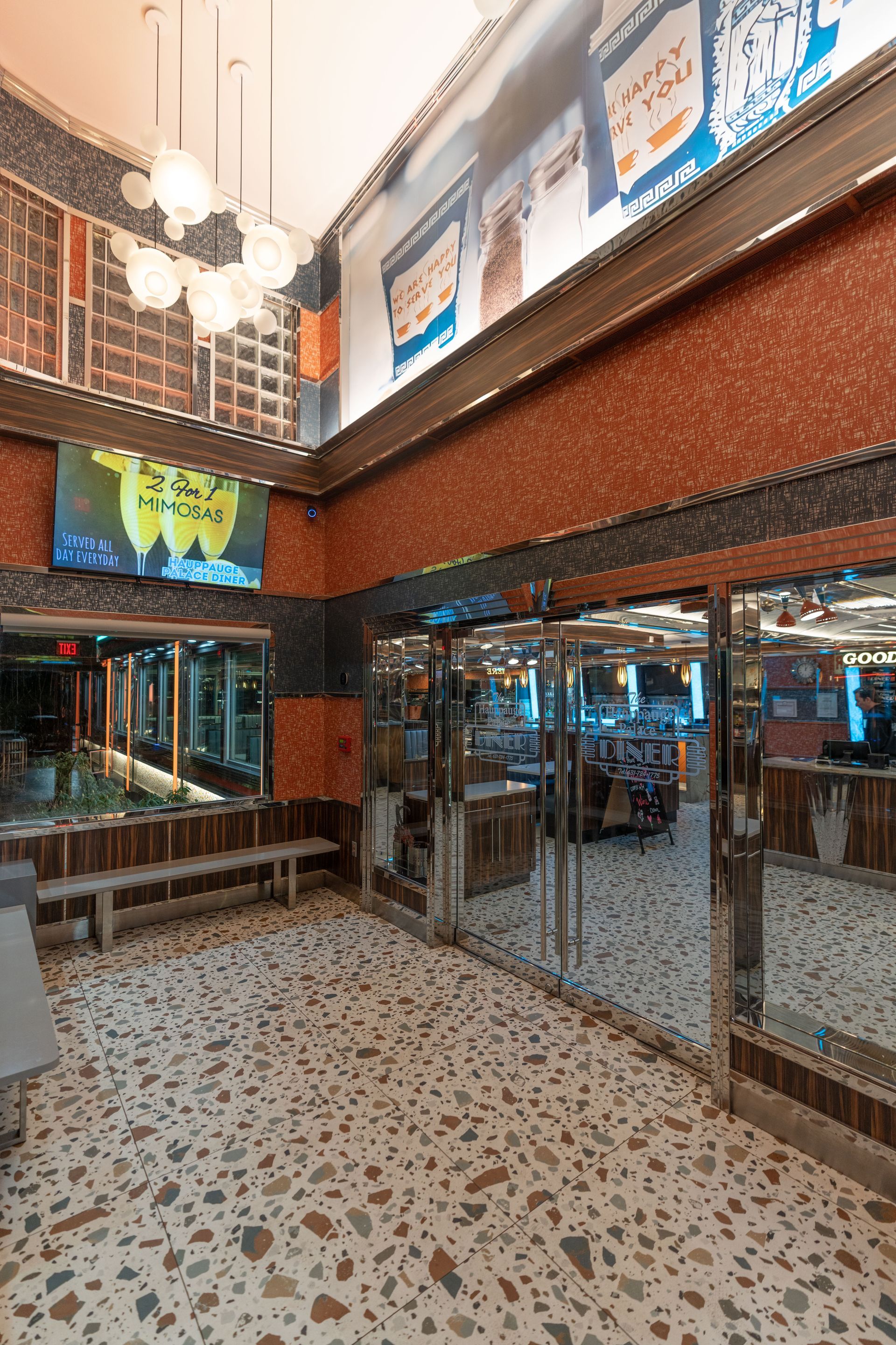 A large room with a lot of windows and a sign that says happy halloween