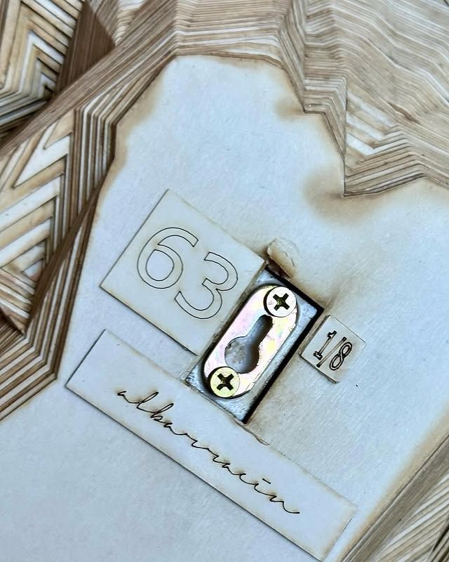 A piece of wood with the number 63 on it