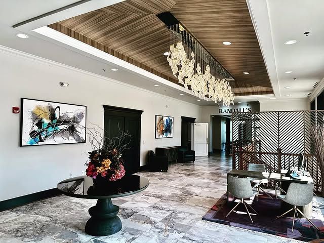 A large room with a table and chairs in it