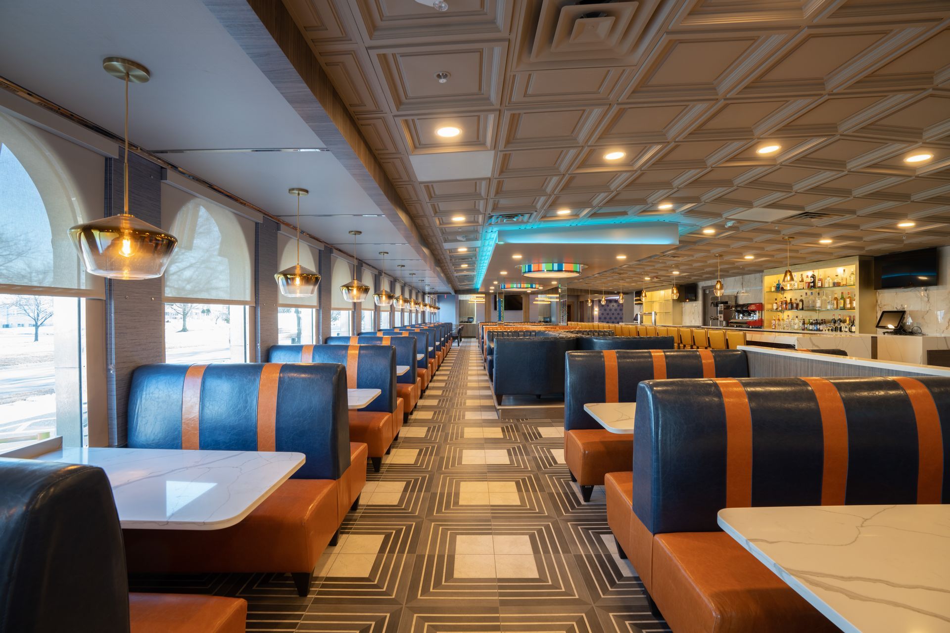 A diner with a lot of booths and tables.