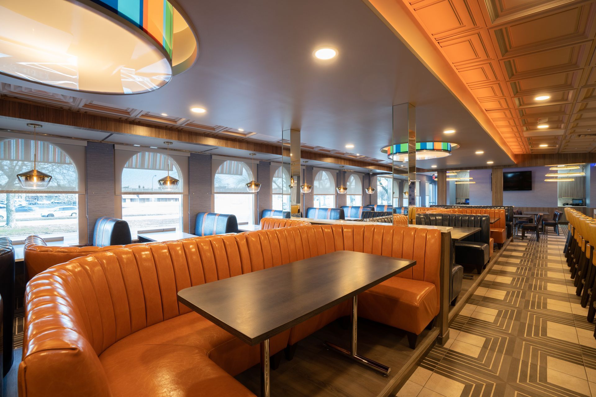 A diner with a lot of booths and tables.