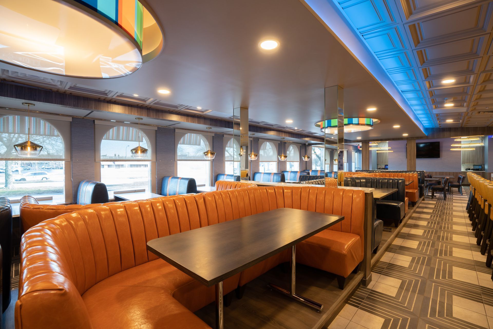 A diner with a lot of booths and tables.