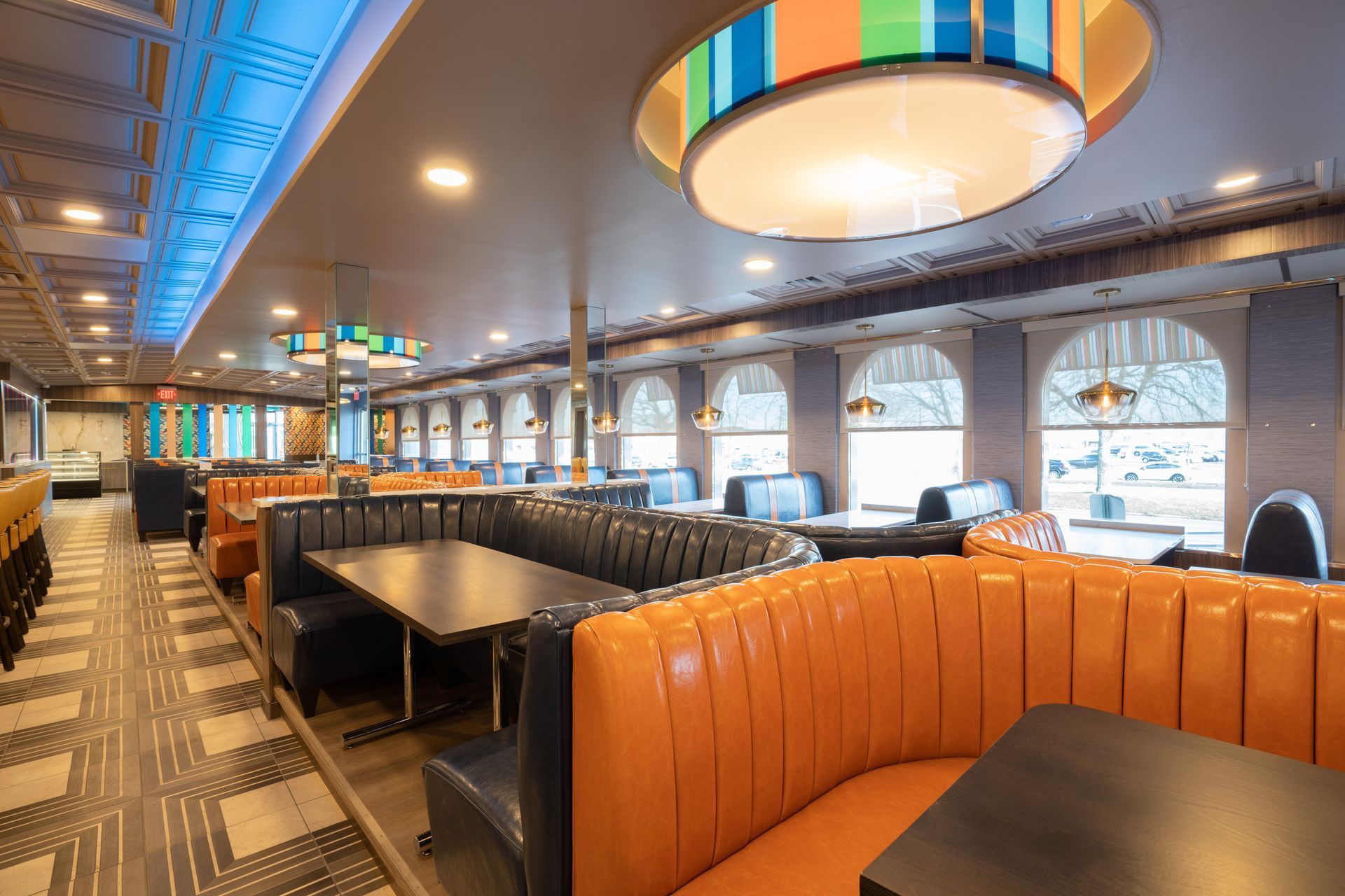 There are many tables and benches in the restaurant.