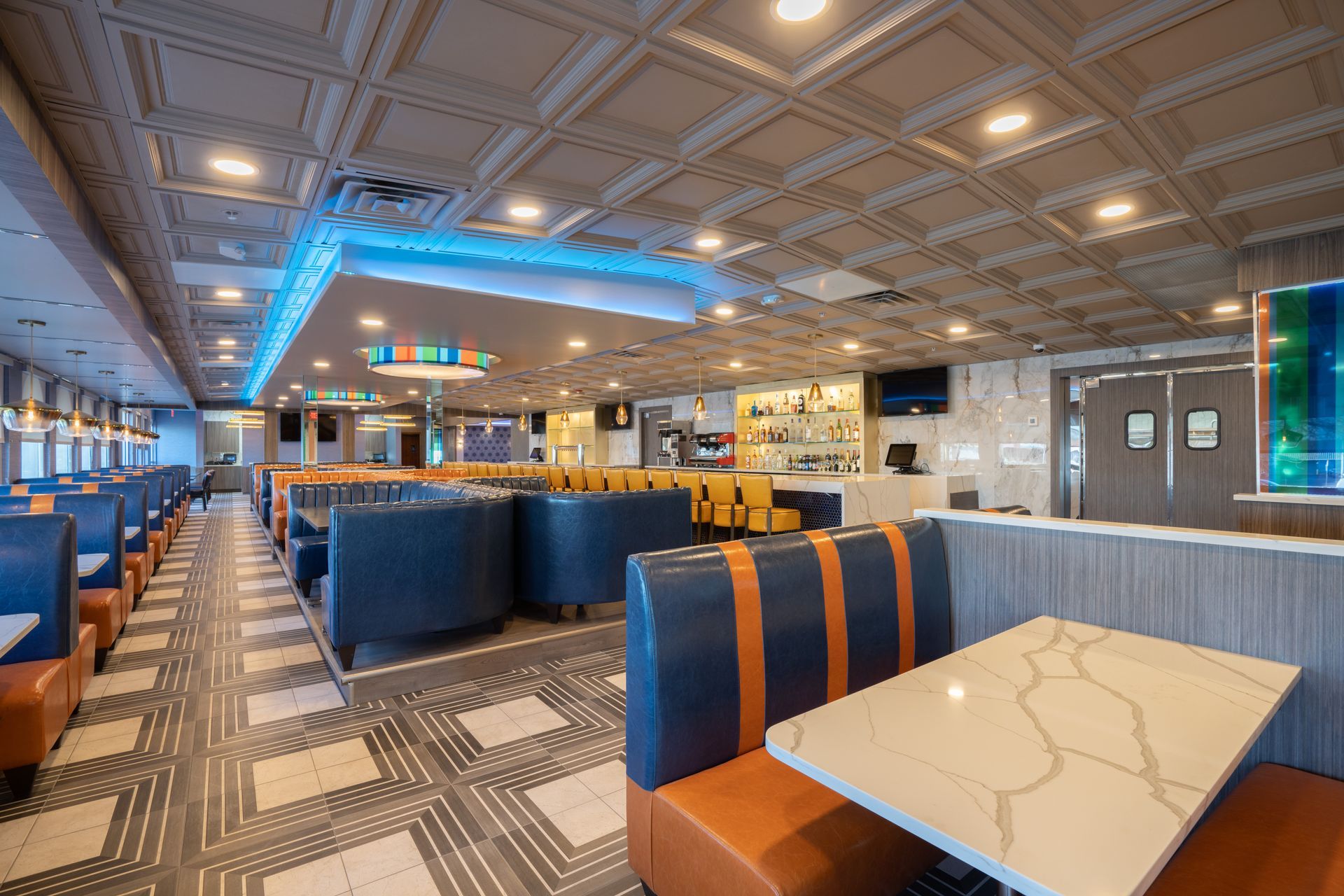 A diner with a lot of booths and tables.