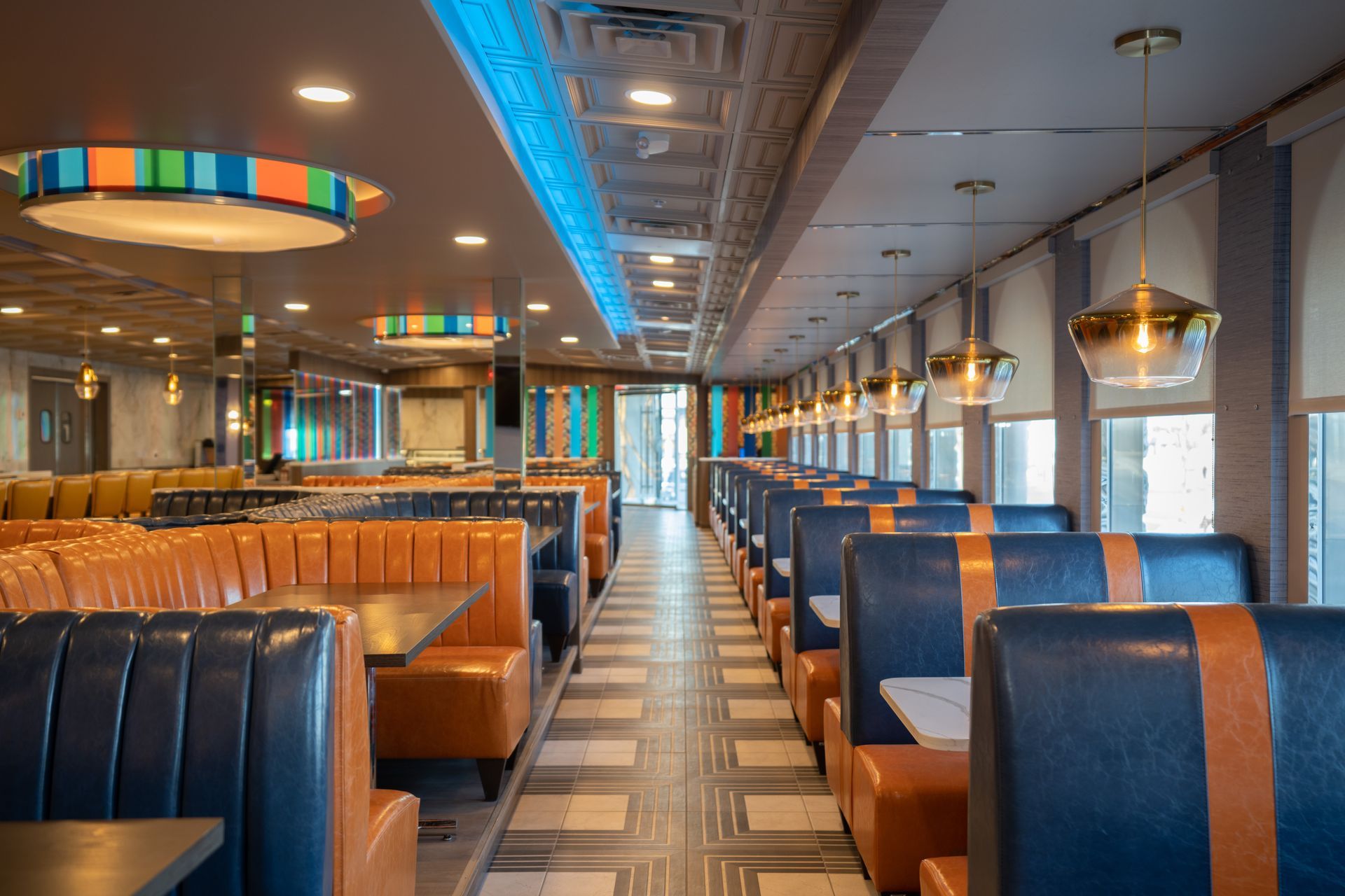 A diner with a lot of booths and tables.