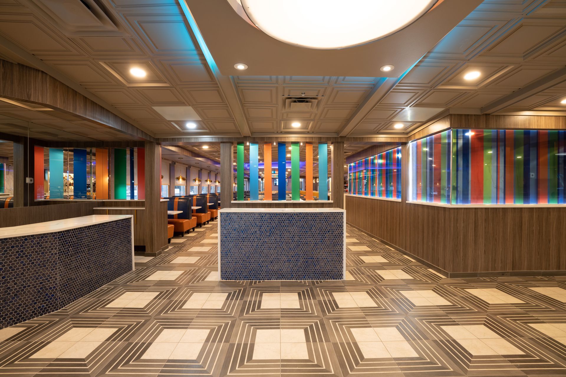 A large room with a colorful painting on the wall.