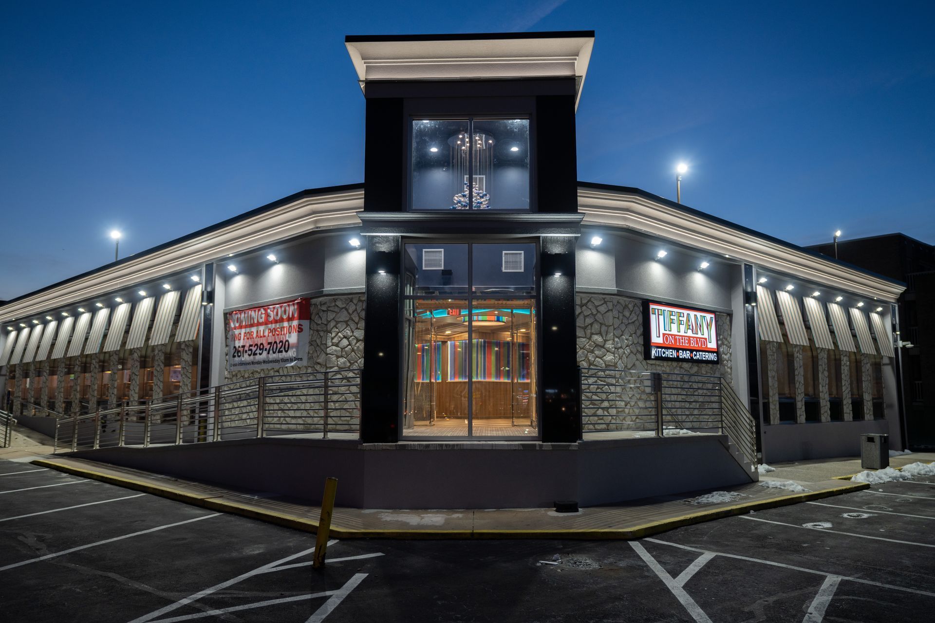 A large building with a for sale sign on the side of it