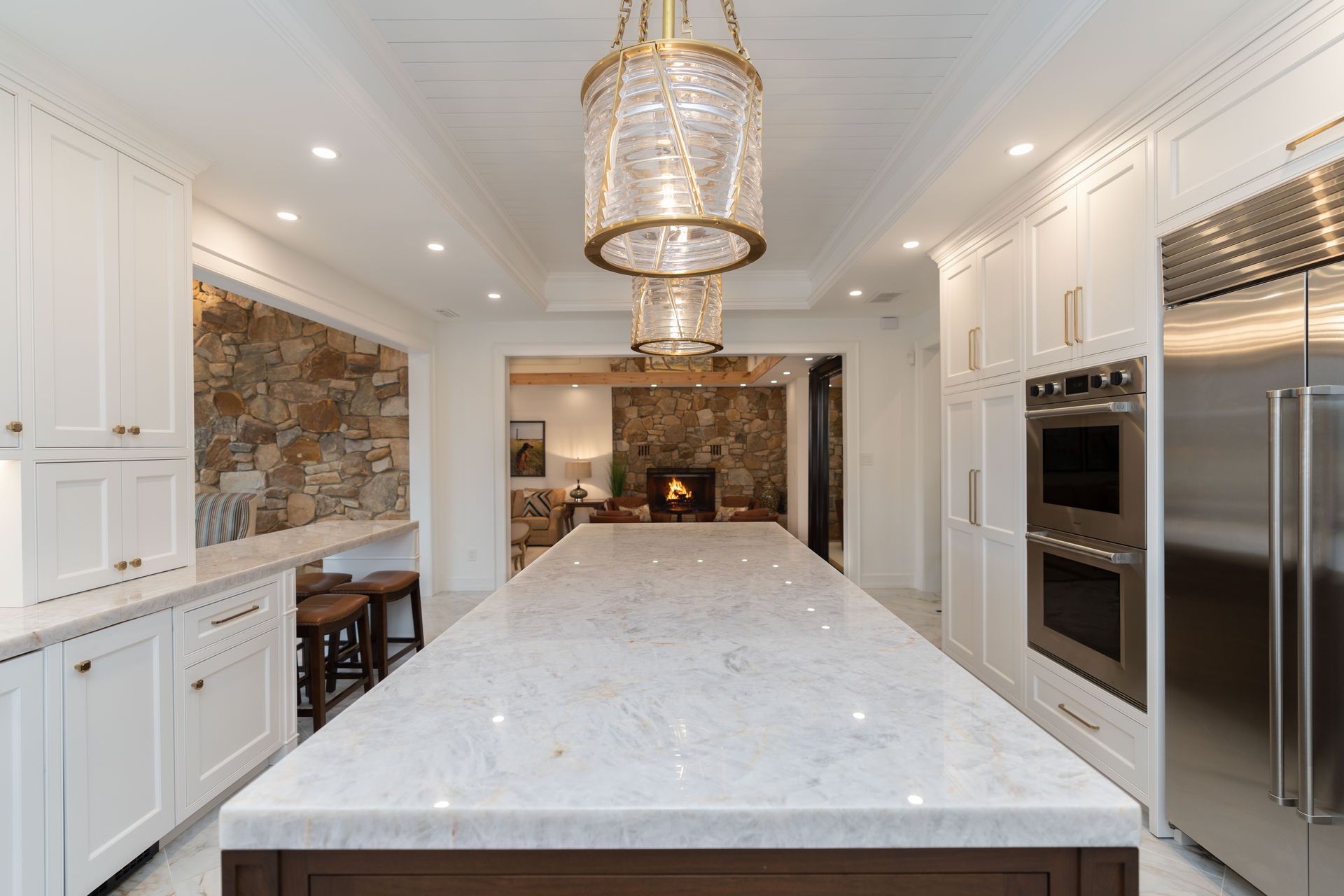 There is a large island in the middle of the kitchen.