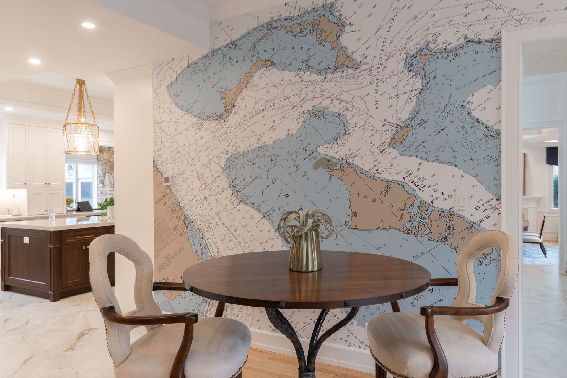 A dining room with a table and chairs and a large map on the wall.