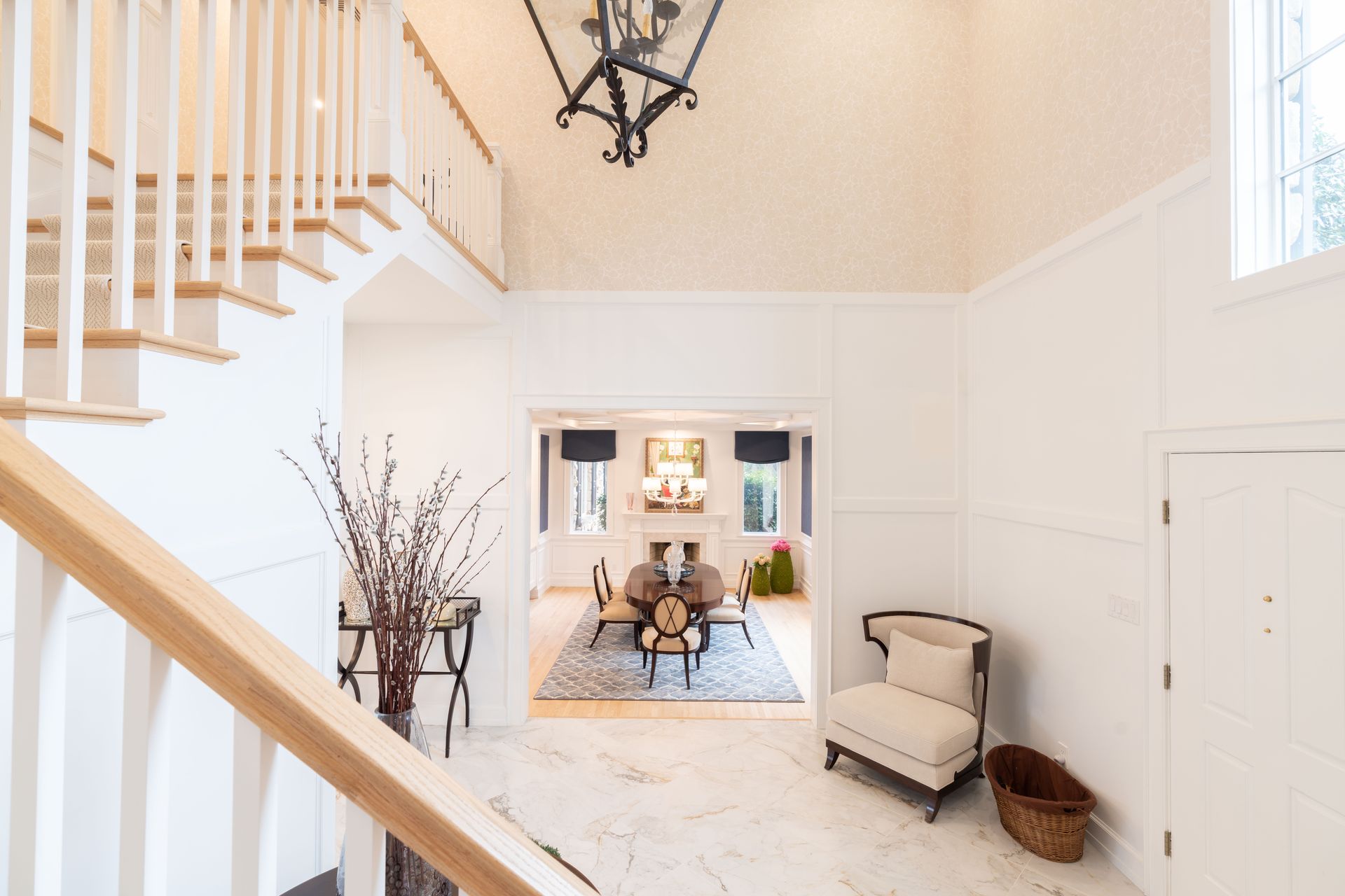 A staircase leading up to a living room in a house