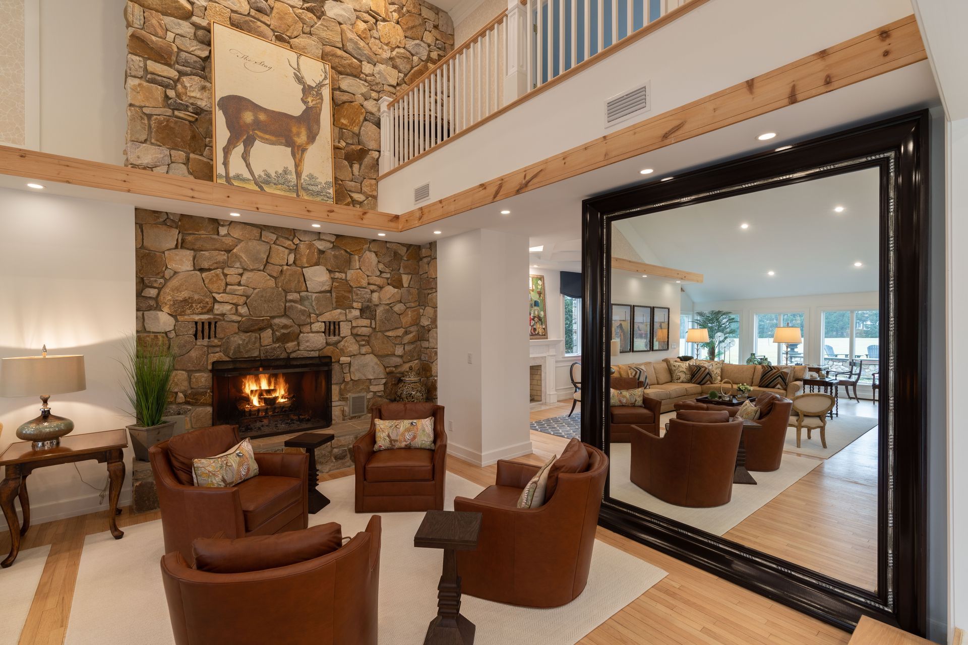 There is a large mirror in the middle of the living room.