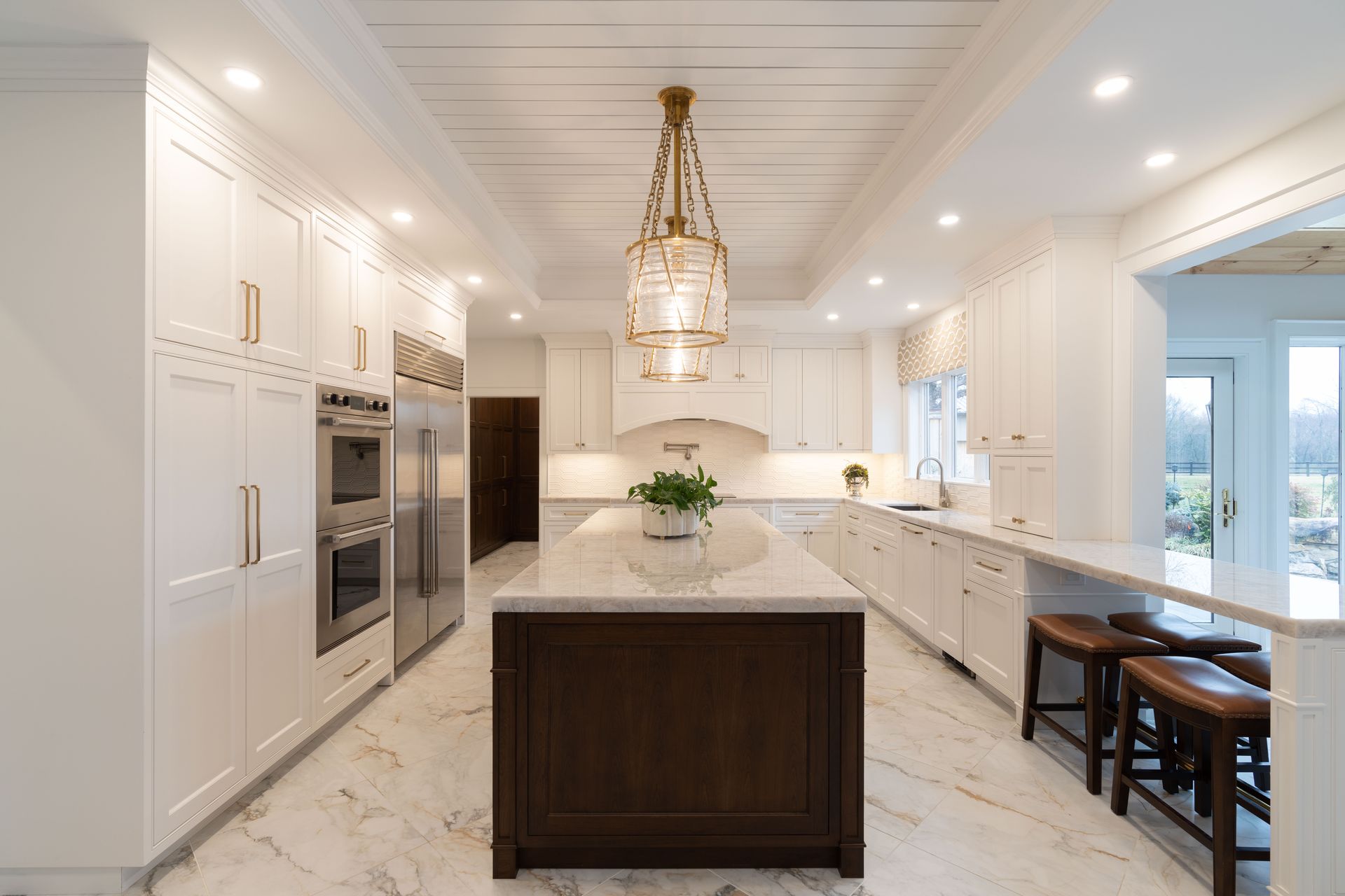 There is a large island in the middle of the kitchen.