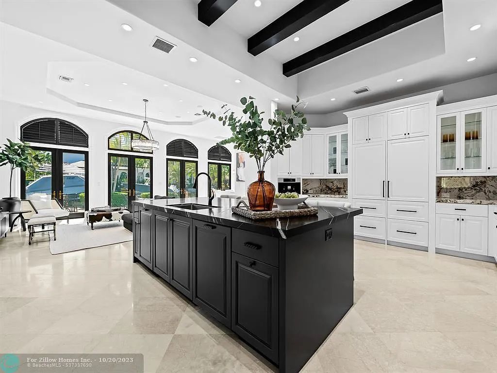 There is a large island in the middle of the kitchen.