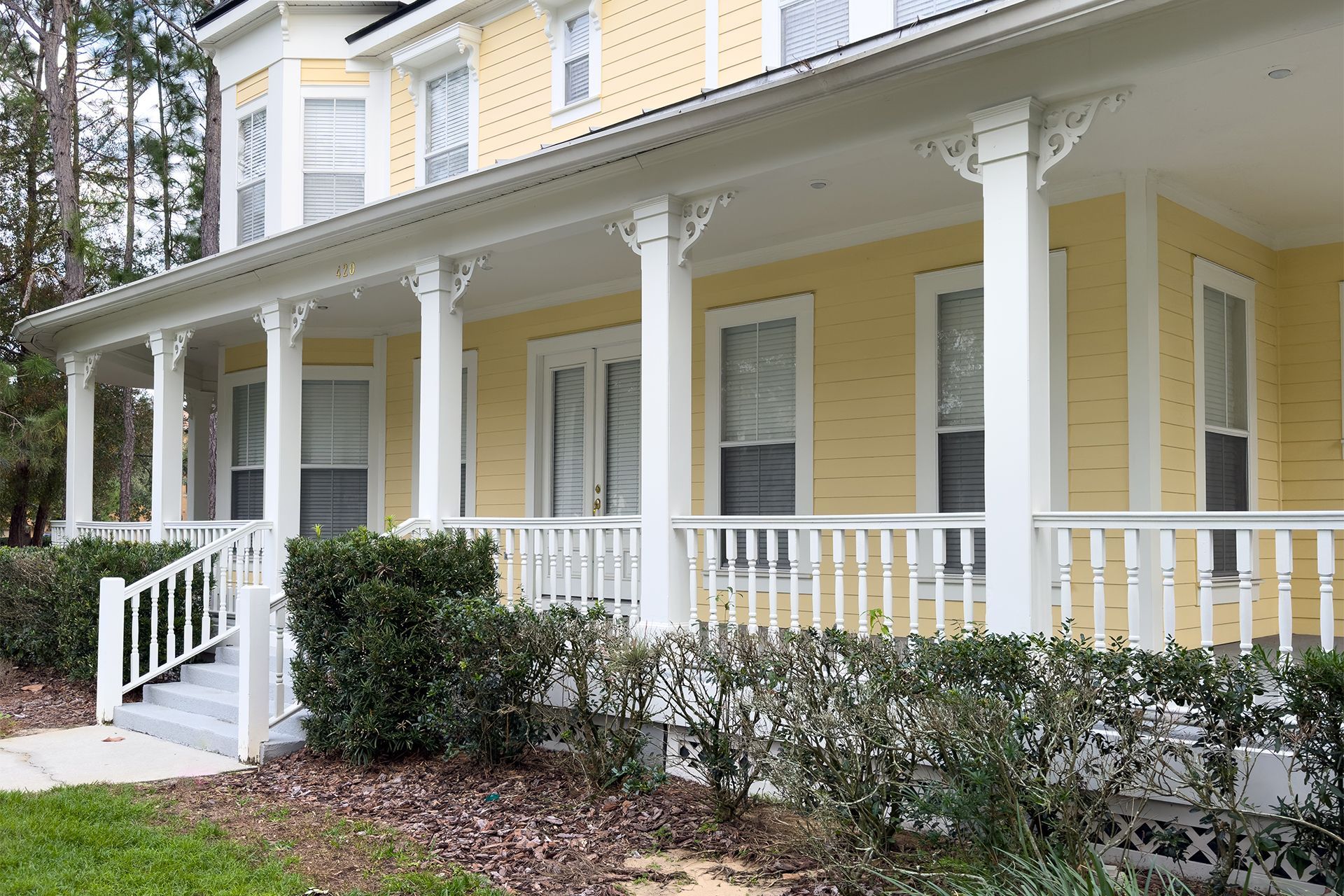 Traditional House With Vibrant Yellow Siding