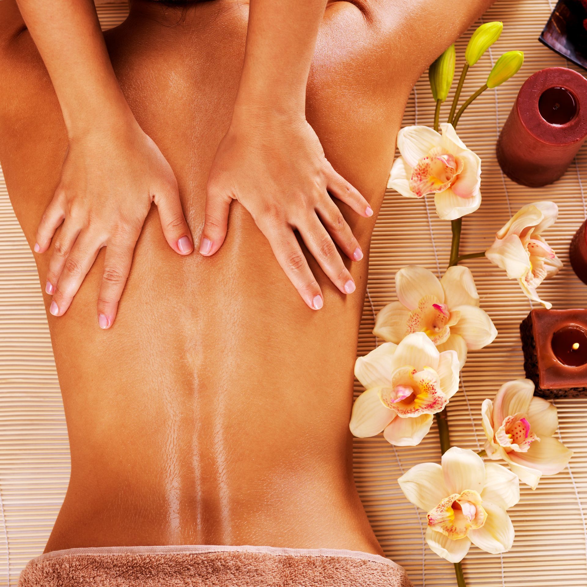 A woman is getting a head massage at a spa.