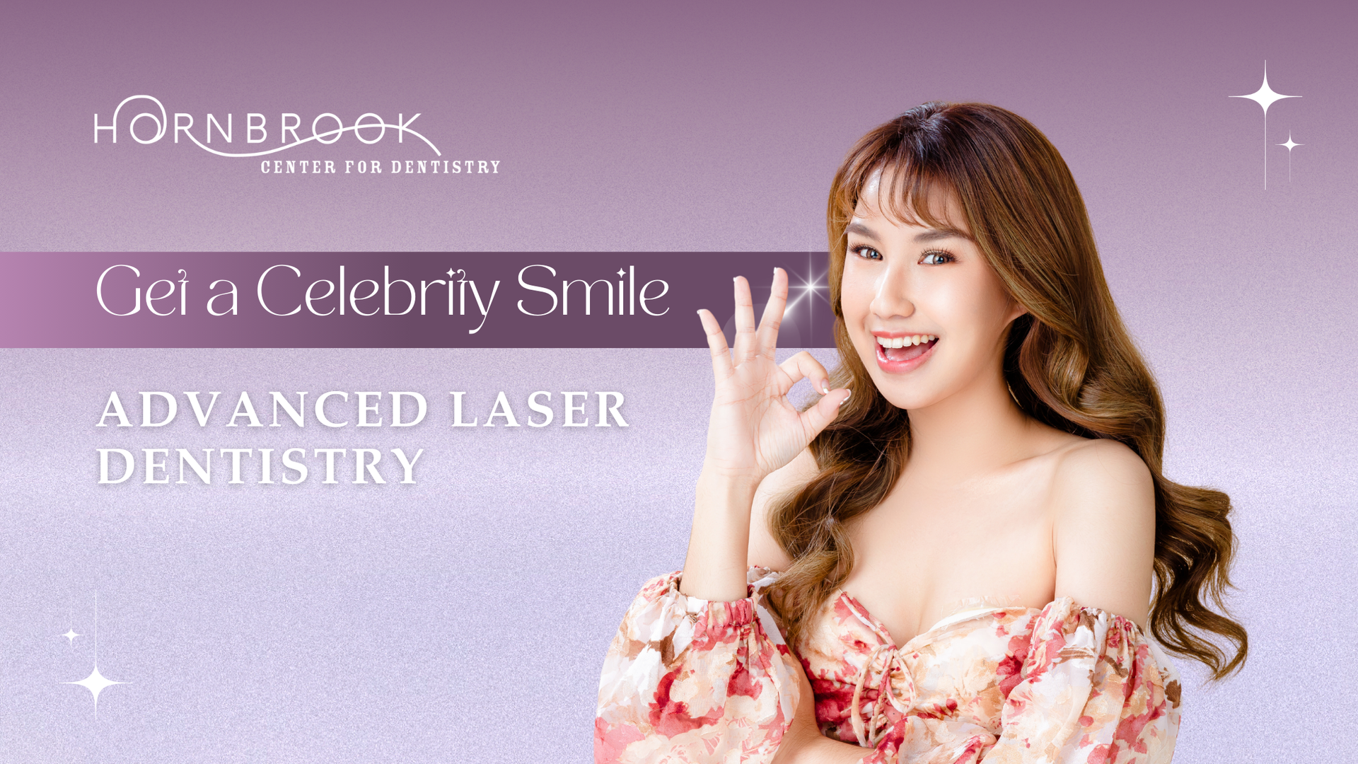A woman in a floral dress is smiling and giving the ok sign.