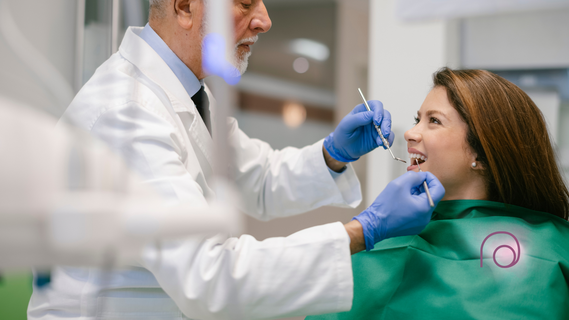 A dentist is examining a woman 's teeth in a dental office.