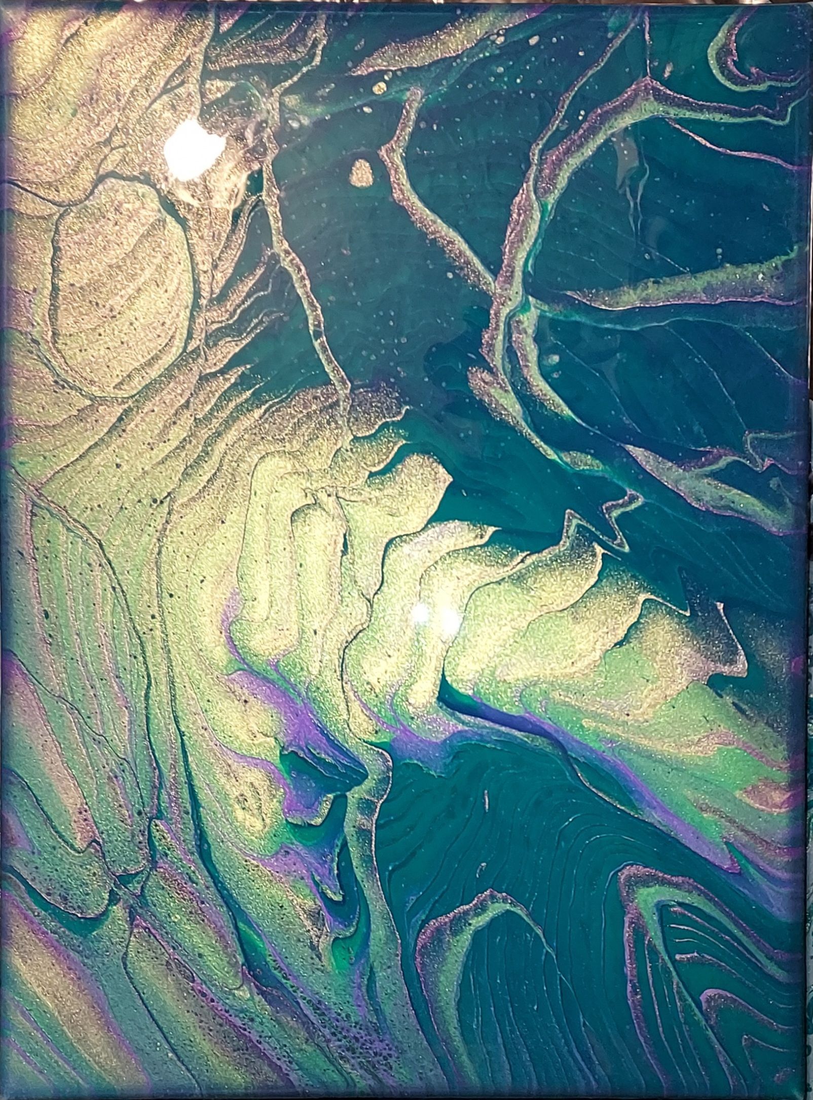 A close up of a painting with a rainbow of colors