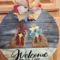 A welcome to our coop sign with two chickens wearing sunglasses.