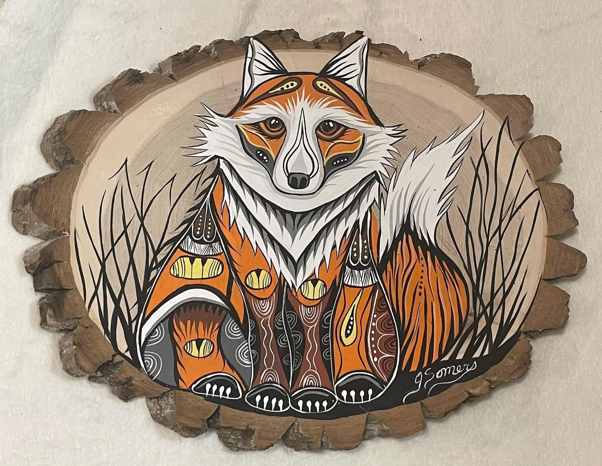 A painting of a fox on a piece of wood