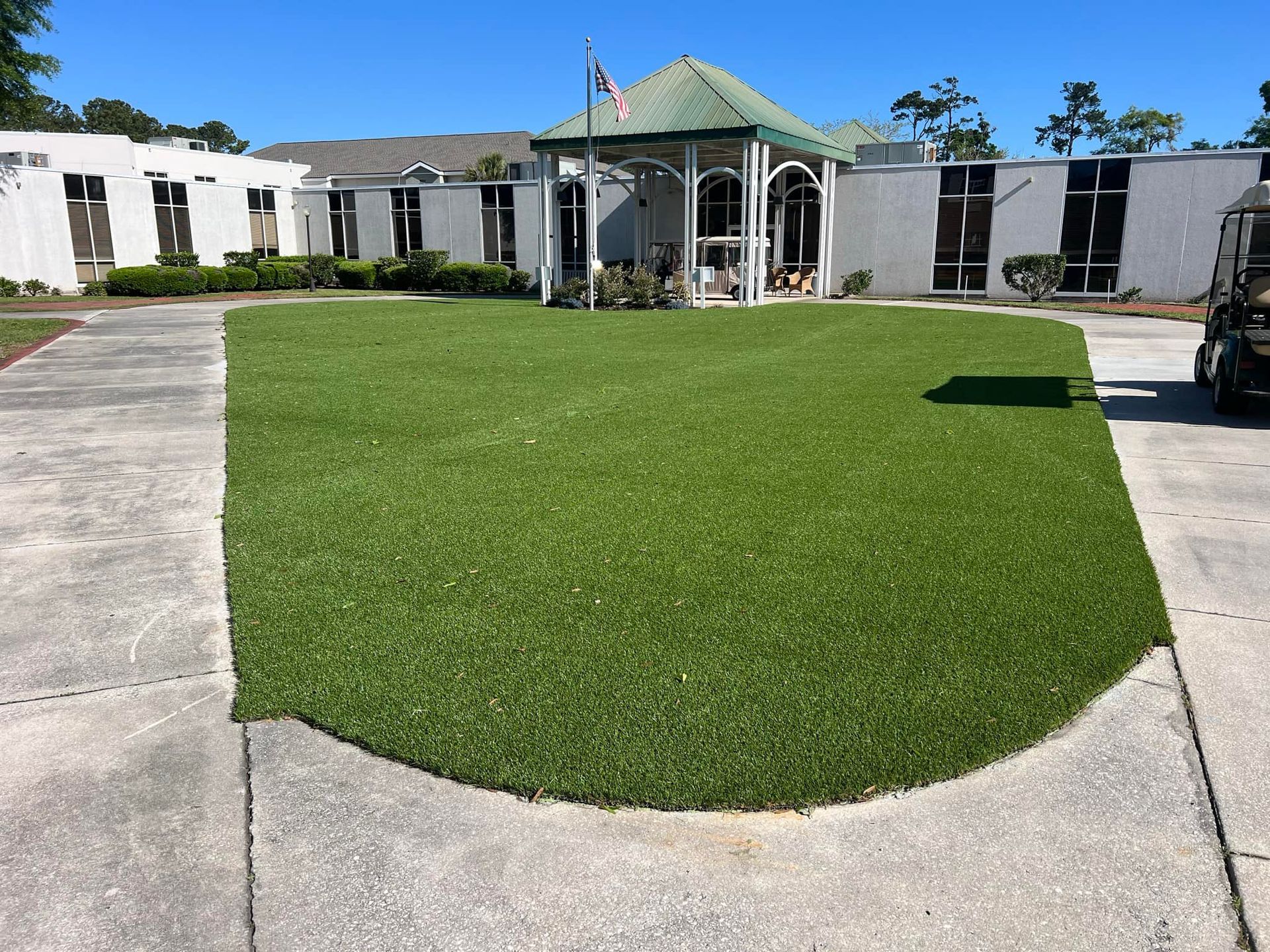A house with a large lawn in front of it
