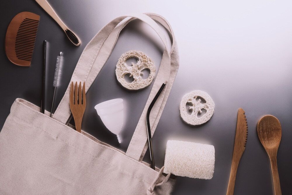 A Tote Bag Filled With Wooden Utensils And A Comb — Café and Restaurant in Whitsundays, QLD