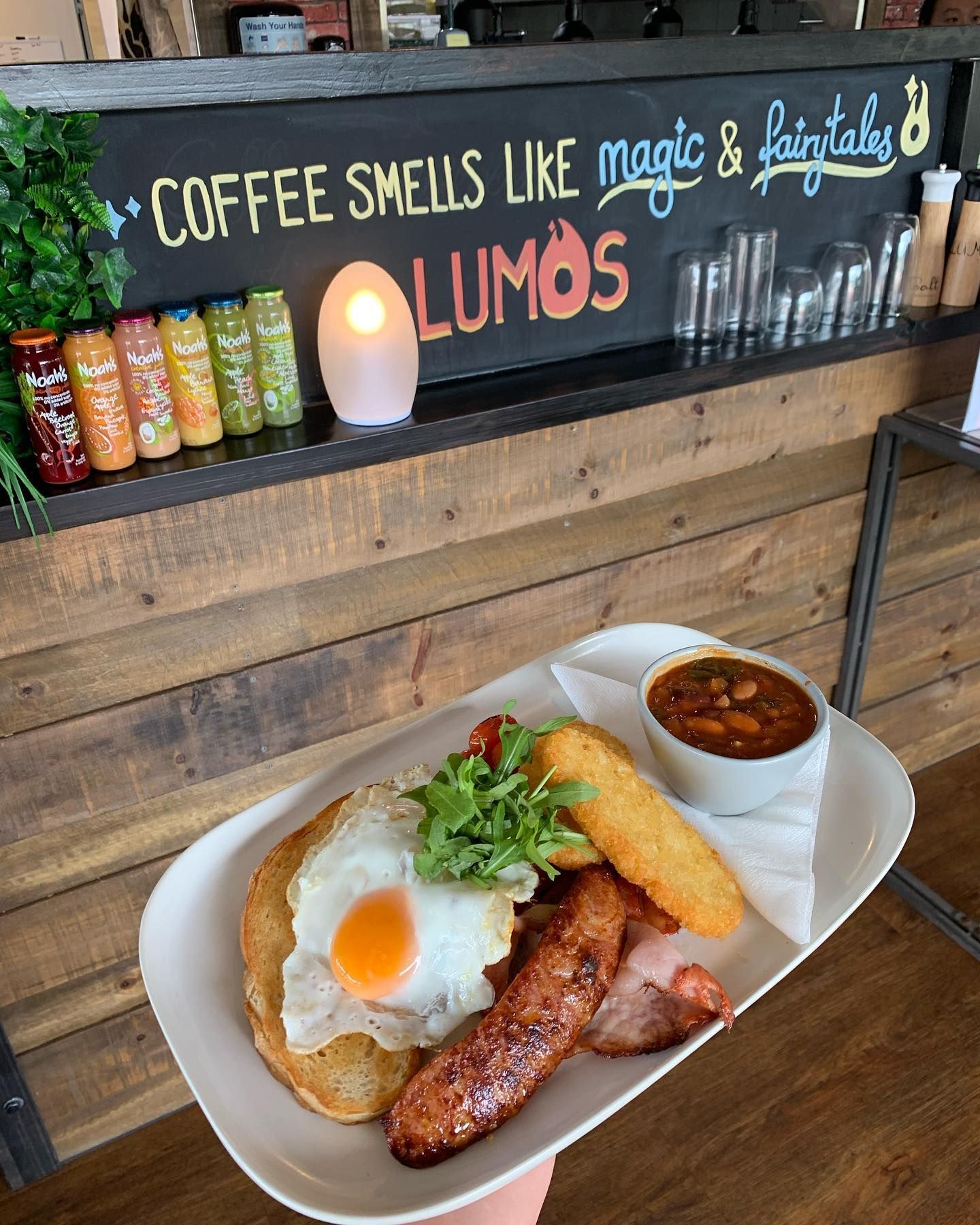 Lumos Cafe & Restaurant Menu Next to a Coffee — Café and Restaurant in Cannonvale, QLD