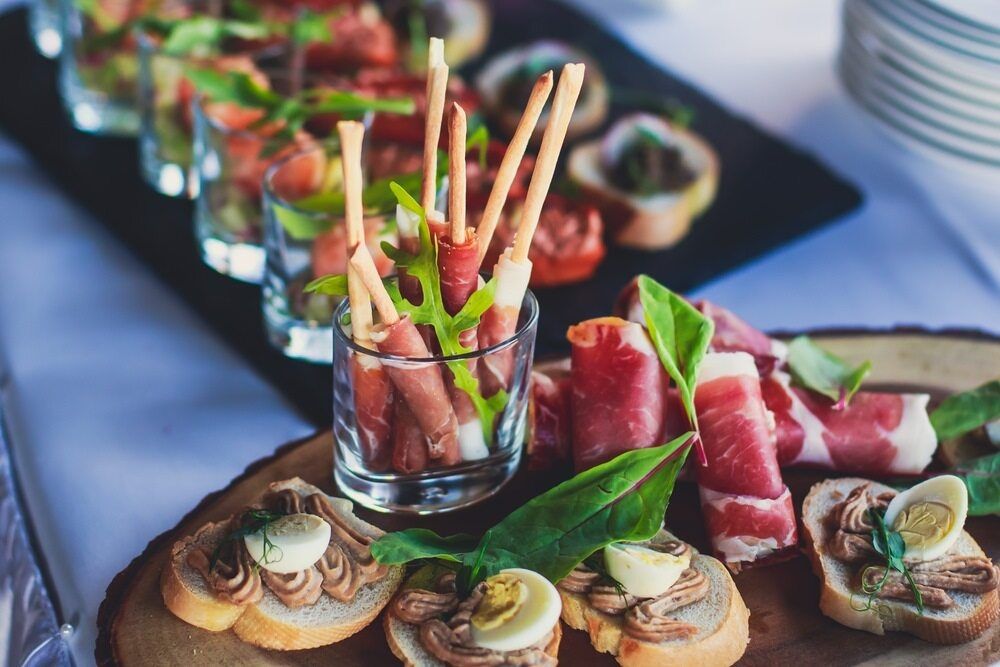 A Wooden Cutting Board Topped With A Variety Of Appetizers — Café and Restaurant in Whitsundays, QLD