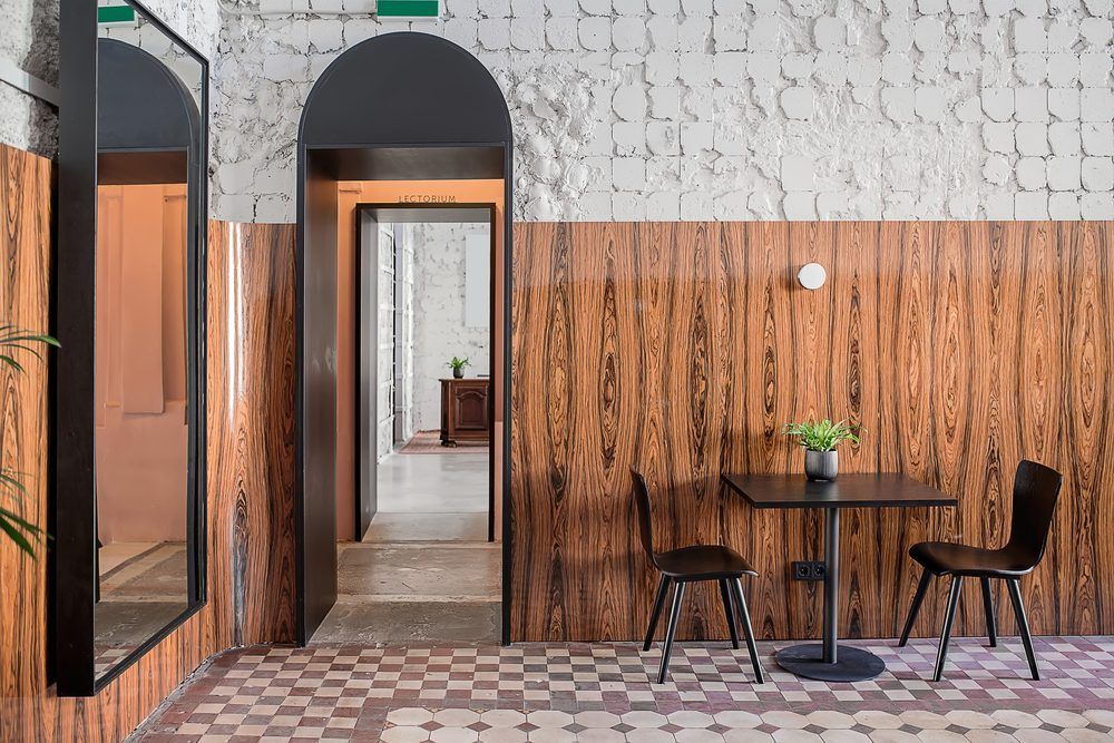 A Room With A Table And Chairs And A Mirror — Café and Restaurant in Whitsundays, QLD