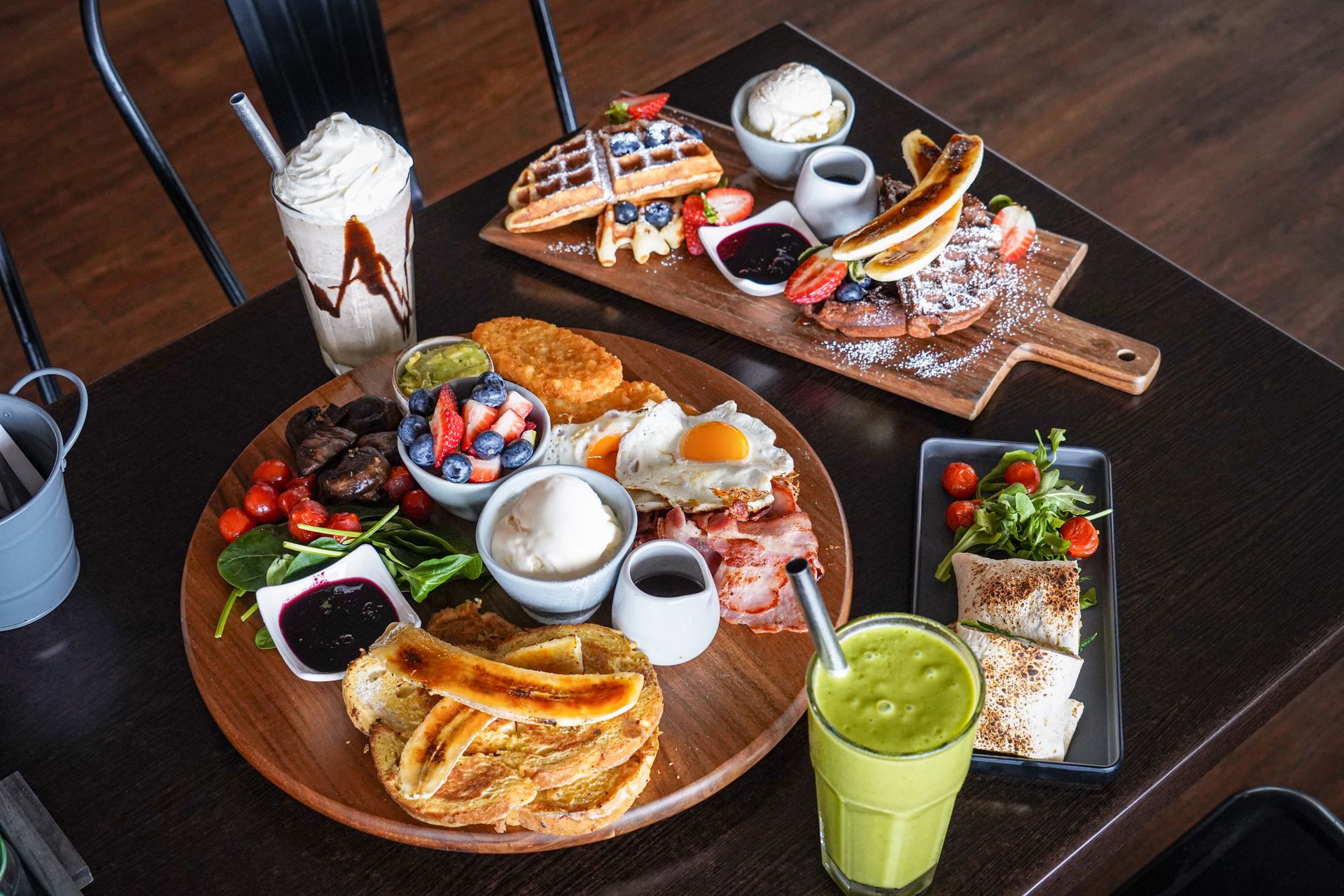 A Group of People Are Posing for a Picture on a Beach — Café and Restaurant in Whitsundays, Qld