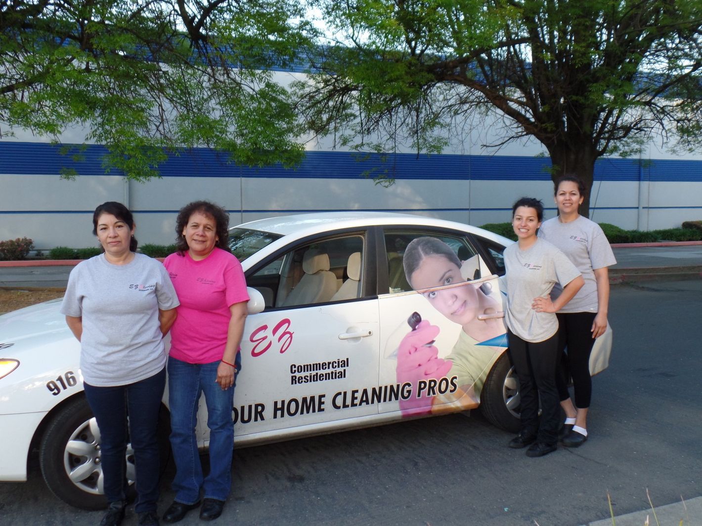 Staff beside the car  — Sacramento, CA — E-Z Living Cleaning, LLC