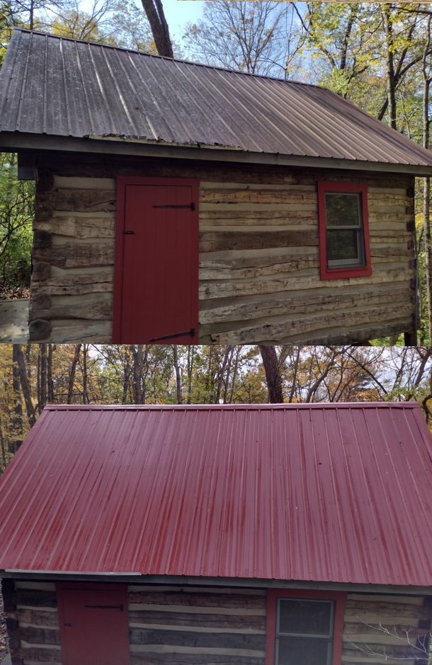 a log cabin with a red door and a red roof .