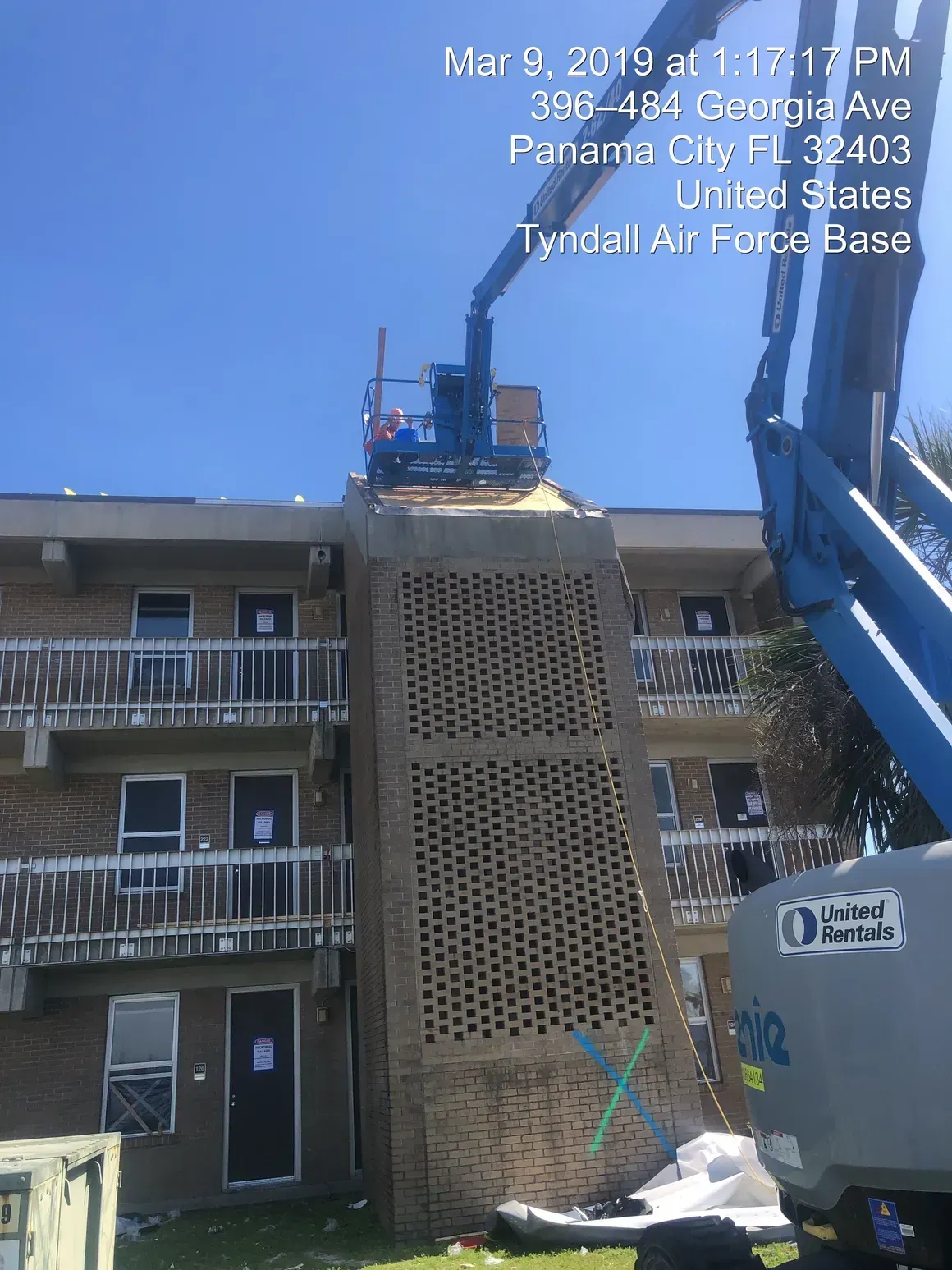 Building at Tyndall Air Force Base being worked on with a lift; Panama City, FL.
